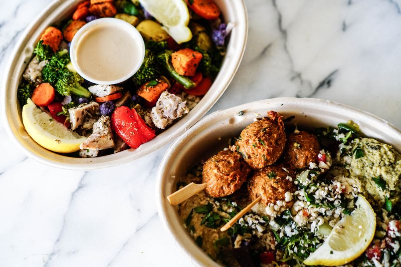 Farro harvest grain bowl with roasted vegetables and tahini