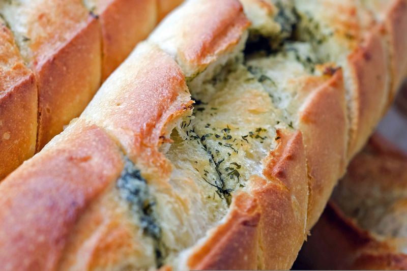 Artisan bread roll with herb butter
